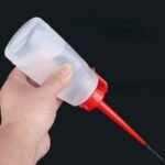 ⁦Burette d’huile plastique rouge⁩ - الصورة ⁦2⁩